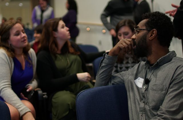 students conversing at a conference